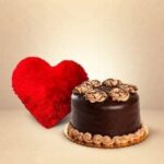 A Heart Shape Pillow with Delicious Chocolate Cake